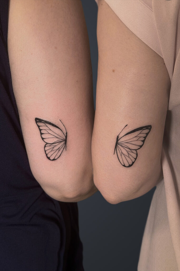Aesthetic Tattoo Art| Fine line, matching tattoos of one half of a butterfly on one client and one half on the other