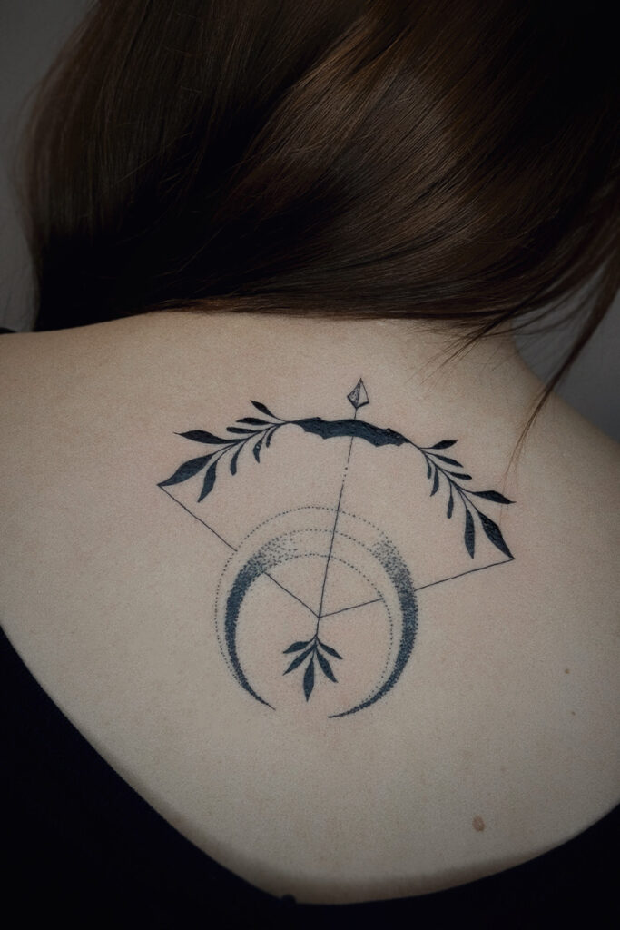 Aesthetic Tattoo Art| Fine line tattoo of a bow and arrow with a crescent moon