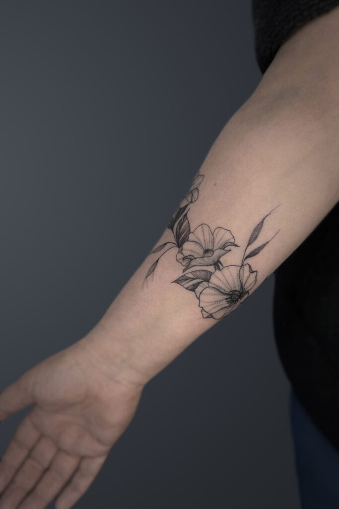Aesthetic Tattoo Art| Fine line, wrap tattoo of flowers and leaves