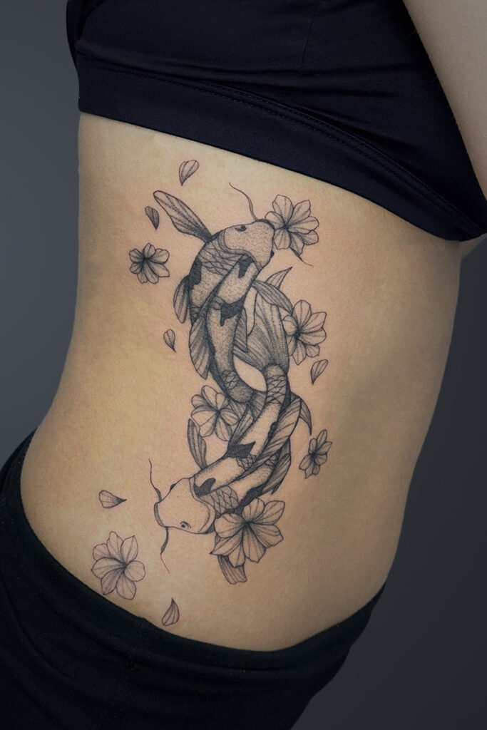 Aesthetic Tattoo Art| Fine line tattoo of flowers and two koi fish