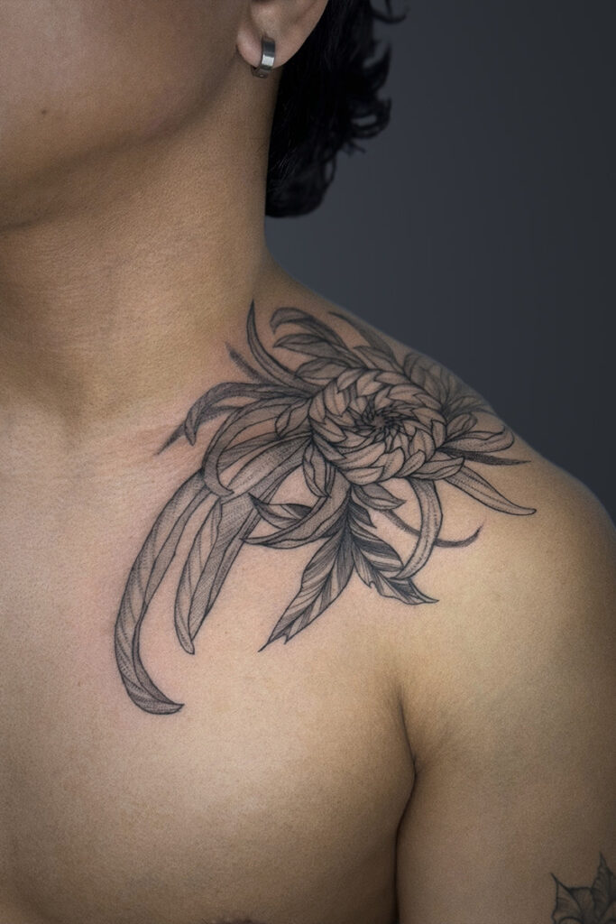 Aesthetic Tattoo Art| Fine line tattoo of a chrysanthemum on the client's shoulder