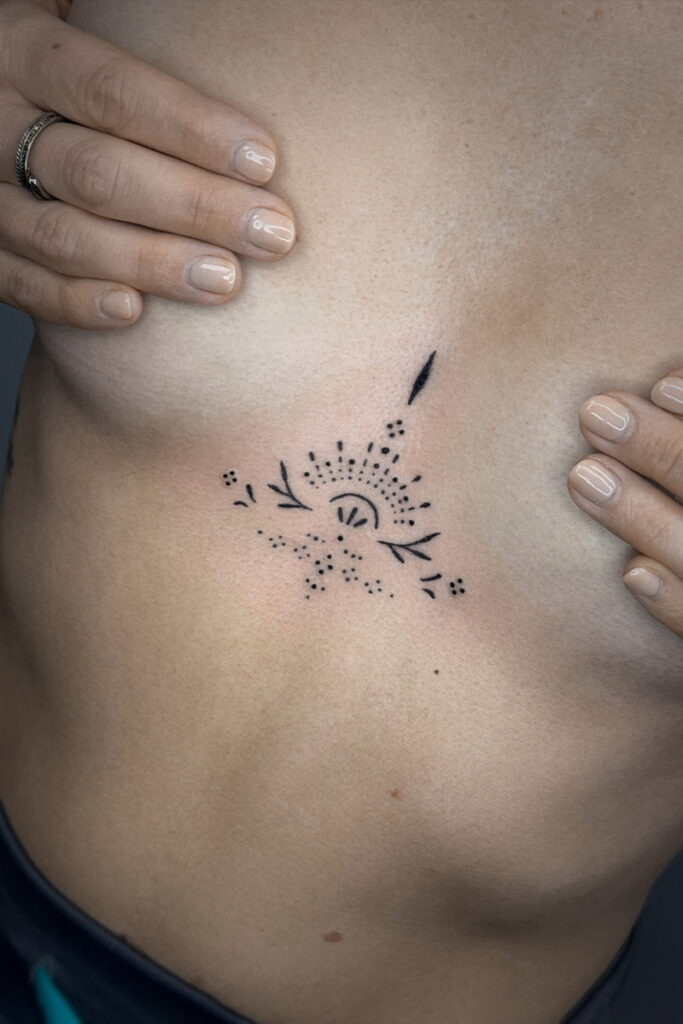Aesthetic Tattoo Art| Small, ornamental, sternum tattoo